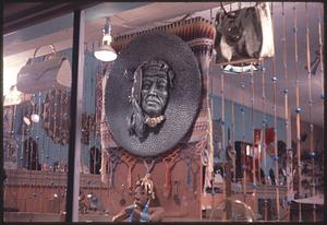 Store window with relief sculpture of a face