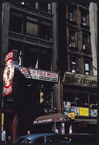 Storefronts including School of Folk Music and New York Music Exchange, Manhattan, New York