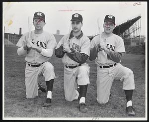 Transplanted Gridders make up the hard-hitting Holy Cross outfield. Left to right, they are Jack Ringel, Bridgeport, Ct., Dick Berardino, Brighton, and Hugo Giargiari, Ashland. Ringel and Giargiari were halfbacks, and Berardino was an end last fall.