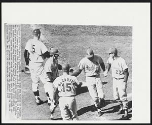 Gibson Brings Home The Margin of Victory-- St. Louis Cards pitcher Bob Gibson is greeted by handshakes as he crosses the plate after his grand slam homer in eight against the Giants. The homer was deciding factor in Cards' 8-6 win over faltering San Francisco. Three who scored ahead of Gibson turn to shake hands are Mike Shannon, Tim McCarver and Dal Maxvill. Behind them is Giants catchers Tom Haller.