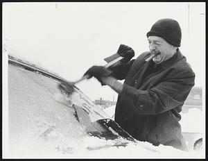 Weather Snow Dec 1970. Arthur Burkei of Quincy clearing windshield before going back home