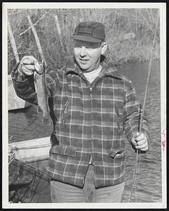 Rainbow Trout is year’s first catch for Herbert J. Arbo of Bainbridge St., Malden. He caught the 14-inch prize in Malden Angler’s Association private pond in Saugus. The association opened its season this morning.