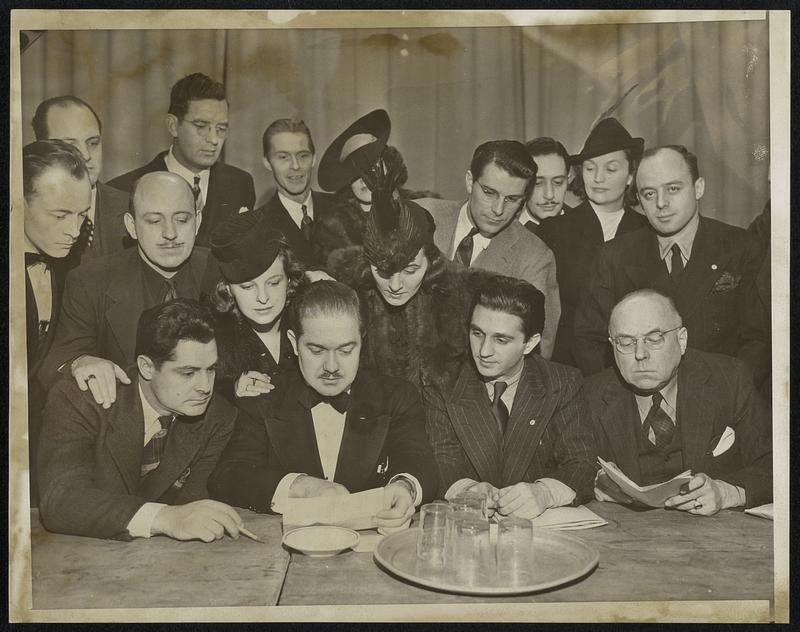 Radio Artists Vote on strike. Chicago, Ill.-The Chicago local of the American federation of radio artists, an affiliate A.F. of L. held a meeting tonight at Forresters hall, on whether to join a national strike of the craft, should one be called. L to R:-seated members of the executive board, Raymond Jones, secretary of Chicago local; Sam Thompson, Vice President of Chicago; George Heller, national secretary and Philip Lord, treasurer Chicago. Chicago bureau serv. N.Y. & Directs.