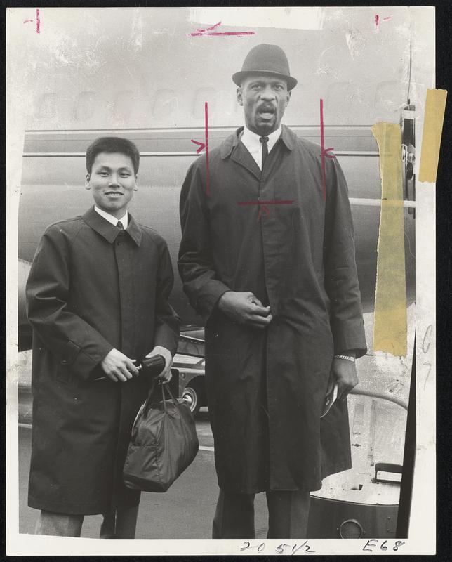 Leaving for Los Angeles by American Airlines. L-R. Morio Shigematsu, marathon winner. Bill Russell, Celtic captain.