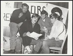Draft resistance leaders explain literature to counselee. From left, Harold Hector, Jr., BDRG high school organizer, Timothy Bright, Resistance leader, Steve Pailet, Resistance office manager, and counselee, Normal Colpitts of Amherst.