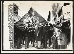 Burn Soviet Flag--Demonstrators burn a Soviet flag on a downtown Washington street a block and a half away from the Russian embassy today. The burning was in protest to the death sentences given two Soviet Jews in the Leningrad airplane hijack trial.
