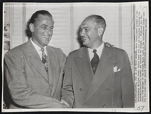 New Phils Manager--Eddie Sawyer, named manager of the Philadelphia Phillies today, shakes hands with his new boss, Club President Bob Carpenter, Jr.(left). Sawyer, who succeeds Ben Chapman -- dismissed July 16, steps from manager of the Toronto Maple Leafs of the International League into his new major league job.