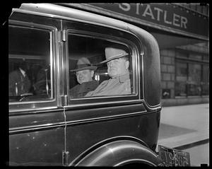 John Llewellyn Lewis in backseat of a car in front of the Hotel Statler, Boston