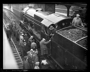 People gathered around a locomotive