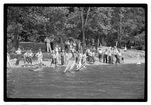 Boys sending out model sailboats