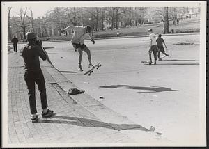 Taking pictures of skateboarders