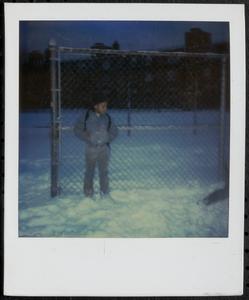 Boy standing in the snow