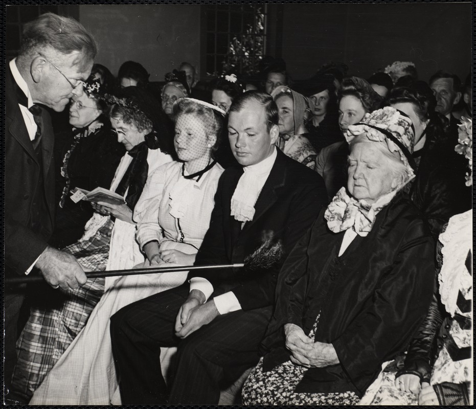 Old Home Day service So. Sutton, N.H. tithing Man - Carol G. Wells about to awaken Mrs. Hughes, 101, with a feather attached to a pole