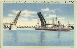 Cherry Street Bridge, showing draw and freighter going trough, Toledo, Ohio