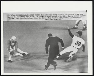 Wills Nipped -- Base-stealing Maury Wills of the Dodgers is an easy out as the Cincinnati Reds catch him trying to steal second in the first inning at Los Angeles tonight. Shortstop Leo Cardenas takes the throw from Catcher John Edwards.