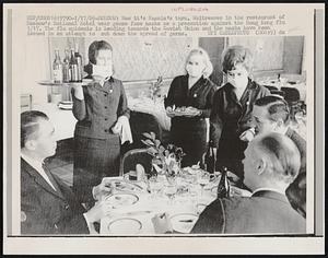 Now it's Russia's turn. Waitresses in the restaurant of Moscow's National Hotel wear gauze face masks as a precaution against the Hong Kong flu 1/17. The flu epidemic is heading towards the Soviet Union and the masks have been issued in an attempt to cut down the spread of germs.