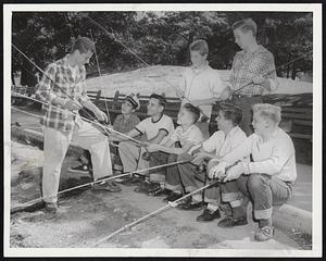 Readying for the Rodeo-John Curtis (left), an instructor at Jamaica Pond , gives these Jamaica Plain boys instructions for the Boston Park Department-Boston Traveler fishing Rodeo this Thursday. The boys are, left to right, seated: Ronald Giuliana, 13, Albert Antosca, 15. Paul Dailey, 14, Eddie Nasson, 14, and Jonathan Boyd, 14. Standing: Alfred Hemmer, 14, and Wayne King, 13.