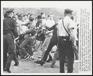 South Charleston, W. Va. – Picketline Fracas – United Auto Workers pickets and non-striking struggle at main gate of struck FMC Corp. Ordnance Division plant today as group of men tried to force way into plant over ranks of strikers. Police broke up fracas with tear gas and arrested three men.