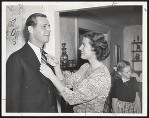 The Final Touch-Mrs. Maurice Tobin straightens her husband's tie just before leaving for his inauguration as Governor.