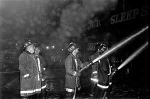 On the left Chelsea L1 Capt. John Doherty and firefighter Phil Dalis center with a line on the fire