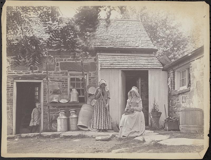 Two women doing chores