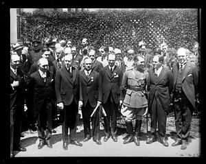 Calvin Coolidge stands with Captain Köhl of Germany and the owner of the Bremer, Baron von Hunefeld and Captain Fitzmaurice of Ireland, who he presented with the Distinguished Flying Cross at the White House, May 2, 1928