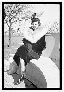 A model posing by the Oliver Wendall Holmes Memorial Sundial