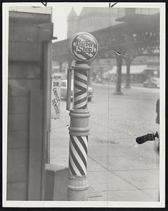Old Time Barber Shop Pole - something seldom seen today - still operates underneath the "El" alongside the sign of a dentist.
