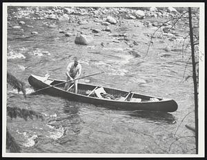 "Davy" Dow, Maine Canoe Champion, Shows How it is Done on Famed Allagash River.