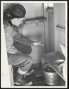 Ice Fishing on Lake Winnipesaukee, N.H. is Dick Barton - Lakefort N.H. Shown in his fishing hut on the lake.