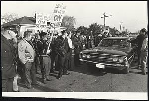 Police Clear Path for car containing non-union employes at General Electric Lynn plant.
