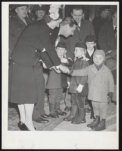 And Here Are The Children-Gov. and Mrs. Tobin welcoming Rep. Henry T. Murray, Jr., of Somerville, and his children at the Washington’s Birthday reception at the State House yesterday. The children, left to right, are Barbara, Ellen, Joanne and Paul.