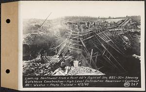 Contract No. 80, High Level Distribution Reservoir, Weston, looking northwest from a point 60 feet+/- right of Sta. 892+50+/- showing gatehouse construction, high level distribution reservoir, Weston, Mass., Apr. 2, 1940