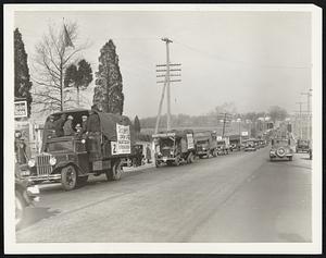 Marchers Arrive In Washington. Truck loads of Washington "Marchers shown when they crossed the boundary line into the district of Columbia from Maryland, Dec. 4, for the opening of congress Dec. 5. They were met and guarded by a large convoy of capital police.