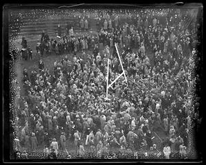 Crowd gathers, around goalposts after Harvard - Holy Cross game