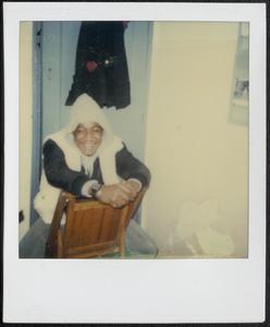 Young man sitting on a chair and smiling