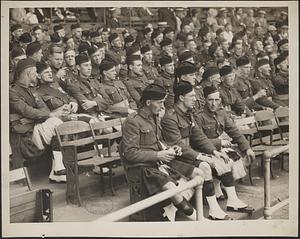 At Braves-Cubs game, members of the Black Watch Regiment watching the game behind the home plate, Tercentenary
