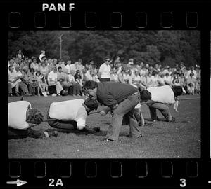 Man yells at tug of war competitors