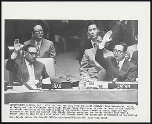 Japan and Iraq Vote for Japan Plan - Dr. Koto Matsudaira, right, of Japan, and Iraq's delegate Abdul Majid Abbass raise their arms to vote in favor of the Japanese-introduced resolution on the Middle East at the Security Council meeting today. Hope for the adoption of the plan was blasted when Arkady Sobolev exercised the Soviet Union's 85th veto a moment later to kill it by a 10-1 vote. Veto brought about the indefinite adjournment of the Middle East debate before the Council.