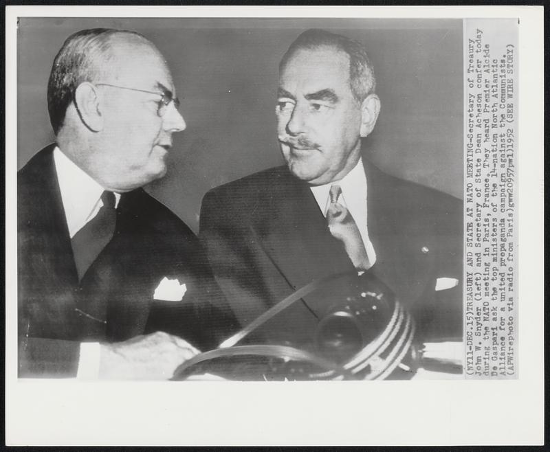 Treasury and State at NATO Meeting- Secretary of Treasury John W. Snyder (left) and Secretary of State Dean Acheson confer today during the NATO meeting in Paris, France. They heard Premier Alcide De Gaspari ask the top ministers of the 14-nation North Atlantic Alliance for a united propaganda campaign against the Communists.