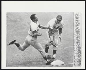 Wills Lost This Race--Maury Wills, shortstop of visiting Los Angeles Dodgers, loses race to first on his bunt attempt on opening play of first of two games between Dodgers and New York Mets at New York's Shea Stadium today. Mets' first baseman Ed Kranepool clutches ball after taking throw pitcher Tracy Stallard to retire the batter.