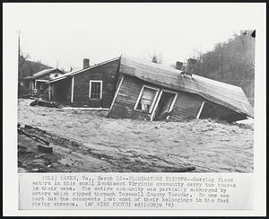 Floodwaters Triumph--Surging flood waters in this small Southwest Virginia community carry two houses in their wake. The entire community was partially submerged by waters which ripped through Tazewell County Tuesday. No one was hurt but the occupants lost more of their belongings in the fast rising streams.