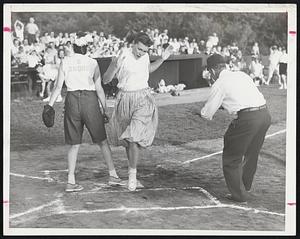 Grand-Slam Homerun in losing cause was stroked by Hobo Mrs. Evelyn Thompson, shown crossing the plate. Snob Catcher Doris Jaquith looks to the stands for a throw which went wild. More than 600 rooters attended the game, mostly Little Leaguers and their friends.