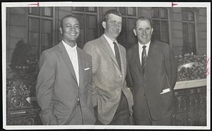 League-Leading Cleveland Indians arrive for important two-game Red Sox series which starts tonight at Fenway Park. Posing in front of Hotel Kenmore are, left to right, Outfielder Larry Doby, Pitcher Bob Lemon and Manager Al Lopez.