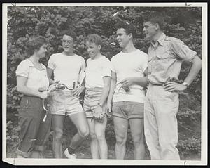 Winners of Harvard Bicycle Race-The winners of a race from Harvard to Wellesley College campus shown receiving their award from Miss Nancy Plowman of Wellesley (left) while Robert Lawthers, president of the Harvard Outdoor Club (right), looks on. The winners, left to right, are Vaclav Benes, grandnephew of the premier of Czechoslovakia; Richard H. Bryant, and James Hornig, all members of the Outdoor Club.