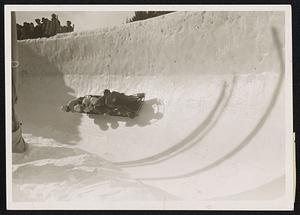 A bobsleigh taking a perilous curve in a world championship contest a St. Moritz, Switzerland.