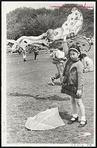 Little Ann Yuen gets set to launch her butterfly kite yesterday in “The Great Boston Kite Festival” at Franklin Park. Story pg. 8.