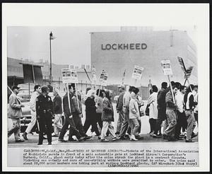 Burbank, Calif. – Strike At Lockheed Aircraft – Pickets of the International Association of Machinists parade in front of a main automobile gate at Lockheed Aircraft Corporation’s Burbank, Calif., plant early today after the union struck the plant in a contract dispute. Picketing was orderly and cars of non-striking workers were permitted to enter. The union said about 20,000 union members are taking part at various Lockheed plants.