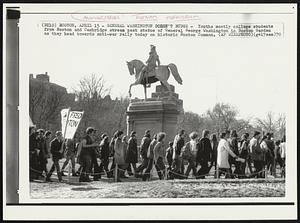General Washington Doesn't Budge- youths mostly college students from Boston and Cambridge stream past statue of General George Washington in Boston Garden as they head towards anti-war rally today on historic Boston Common.