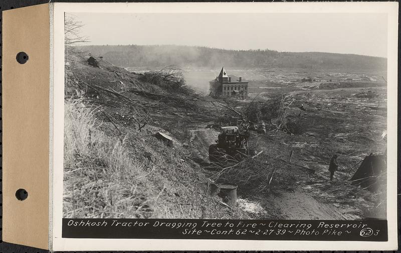 Contract No. 62, Clearing Lower Middle and East Branches, Quabbin Reservoir, Ware, New Salem, Petersham and Hardwick, Oshkosh tractor dragging tree to fire, Enfield, Mass., Feb. 27, 1939